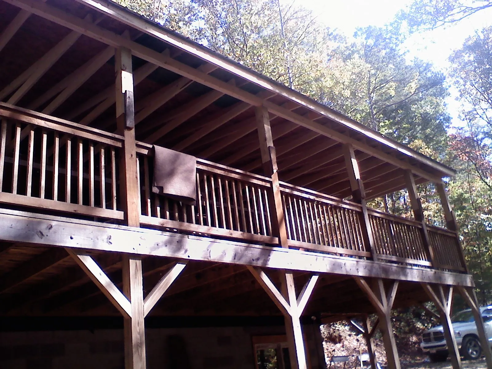 Timber framing under a new elevated porch and deck in Grafton